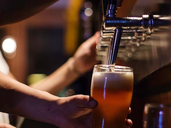 Beer being poured out from a tap
