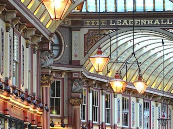 3 lamps hanging from the ceiling inside Leadenhall